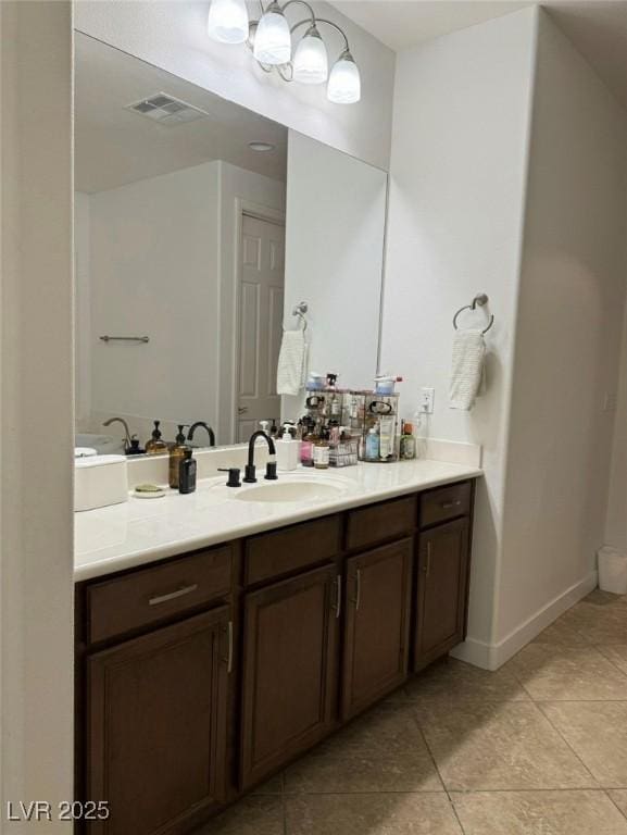 bathroom with vanity and tile patterned floors