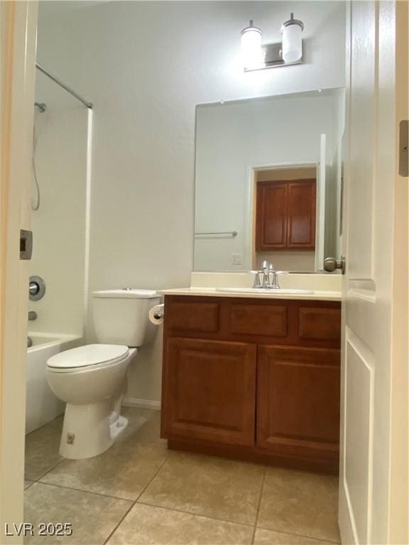 full bathroom with tile patterned flooring, vanity, bathing tub / shower combination, and toilet