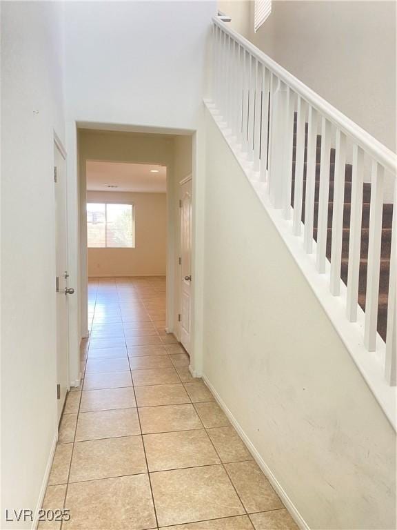 hallway with light tile patterned flooring