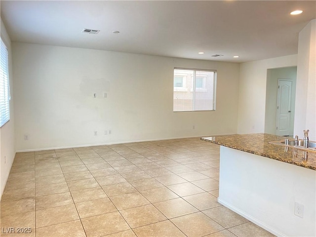 tiled empty room with sink