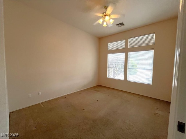 carpeted empty room with ceiling fan