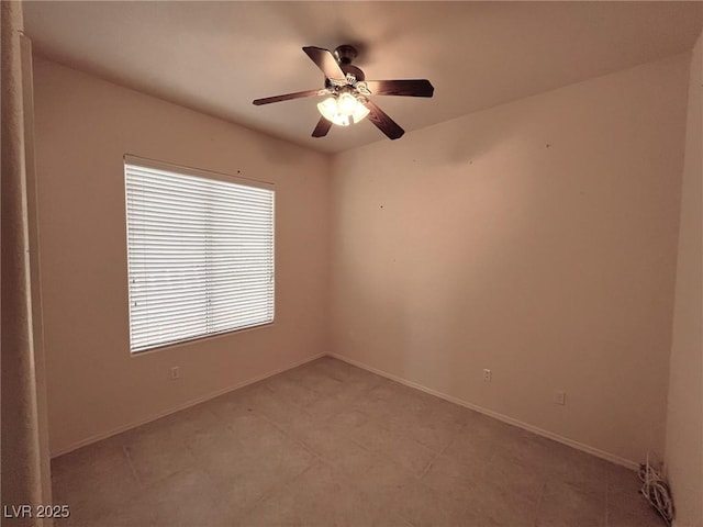 spare room with ceiling fan