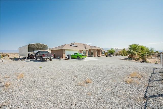 exterior space featuring a carport