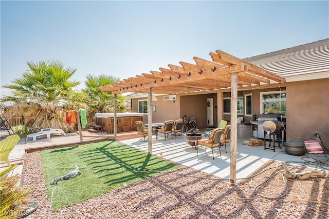 exterior space featuring a pergola, a hot tub, and a patio