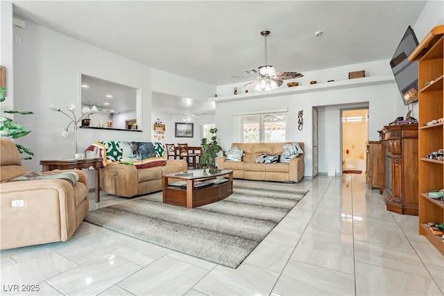 living room featuring ceiling fan