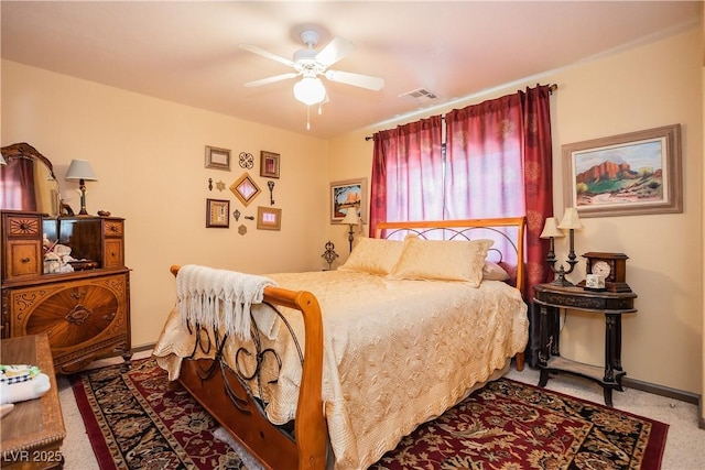 bedroom with ceiling fan and carpet floors