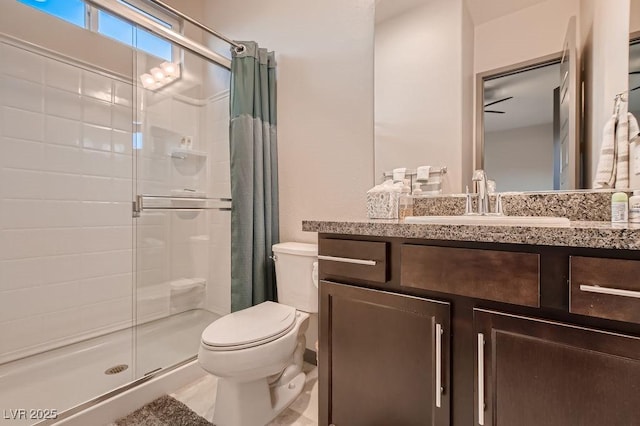 bathroom with vanity, a shower with shower curtain, and toilet