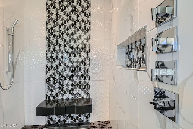 bathroom with a tile shower