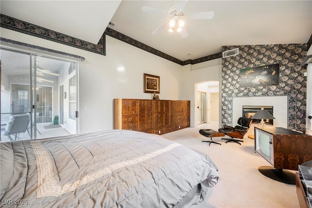 bedroom featuring ceiling fan, light colored carpet, and access to exterior