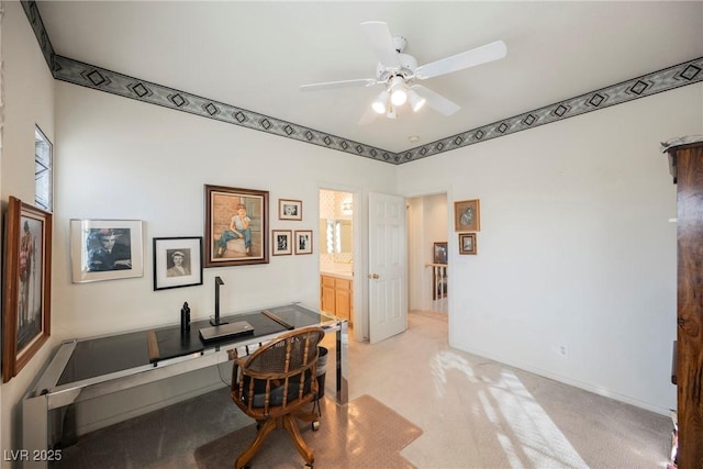 office area with light carpet and ceiling fan