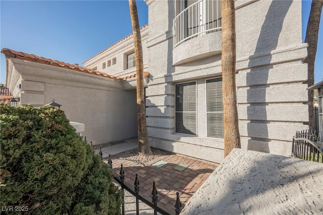 view of side of home with a patio area