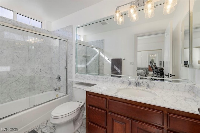 full bathroom with bath / shower combo with glass door, a healthy amount of sunlight, vanity, and toilet