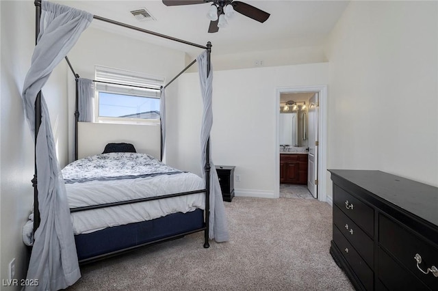 carpeted bedroom with connected bathroom and ceiling fan