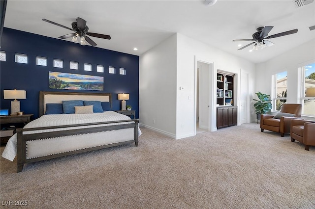 bedroom featuring light carpet and ceiling fan