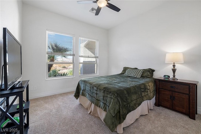 bedroom featuring light colored carpet and ceiling fan