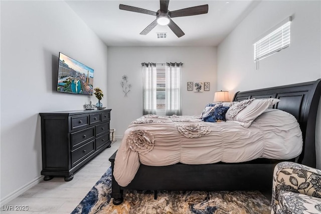 bedroom with light hardwood / wood-style flooring and ceiling fan