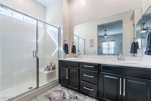 bathroom featuring tile patterned flooring, vanity, an enclosed shower, and ceiling fan