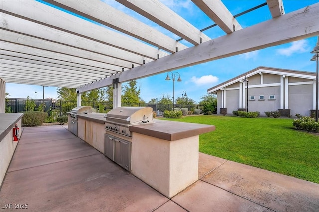 view of patio / terrace featuring exterior kitchen, area for grilling, and a pergola