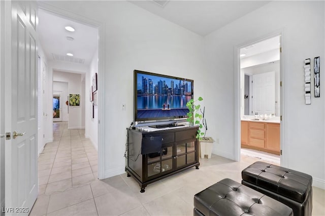 interior space with sink and light tile patterned flooring