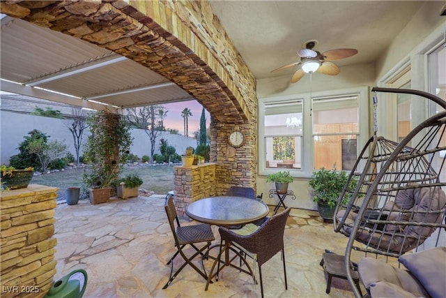 patio terrace at dusk with ceiling fan