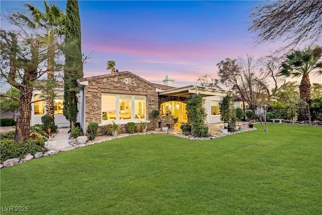 view of front of home featuring a yard