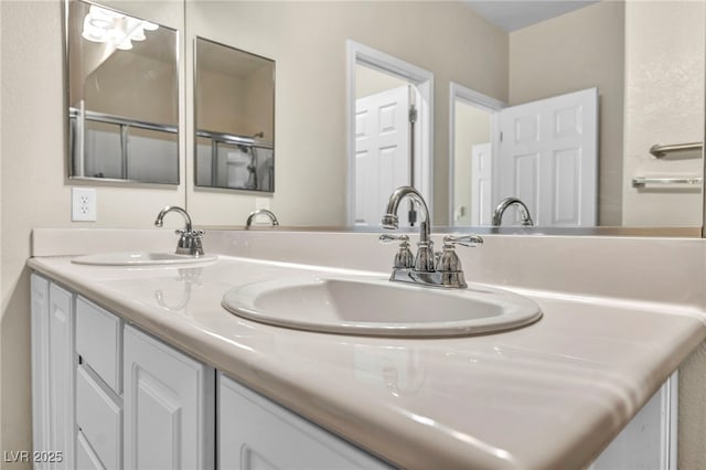 bathroom featuring double vanity and a sink