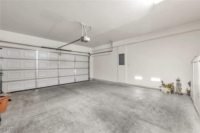 garage with electric panel and a garage door opener