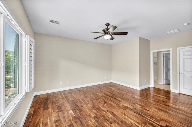 spare room featuring hardwood / wood-style flooring and ceiling fan