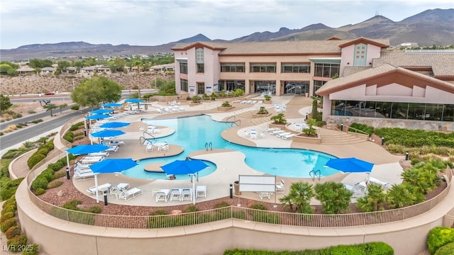 view of pool featuring a patio and a mountain view