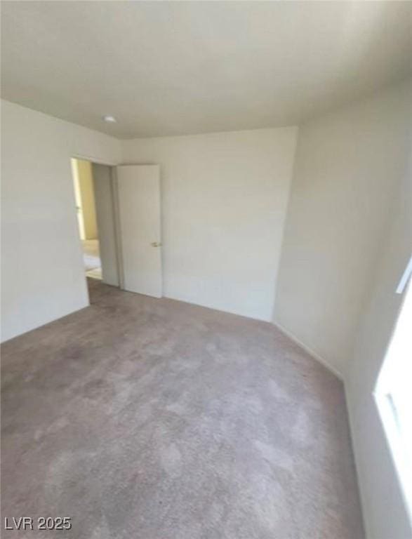 unfurnished room with carpet