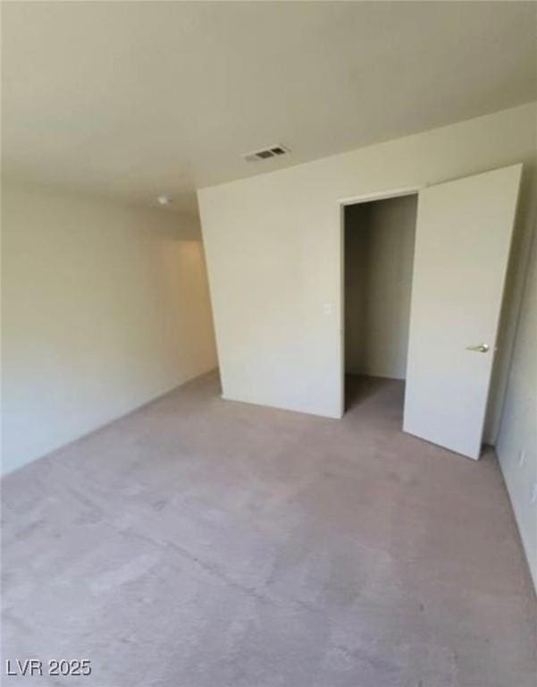 unfurnished bedroom with light carpet