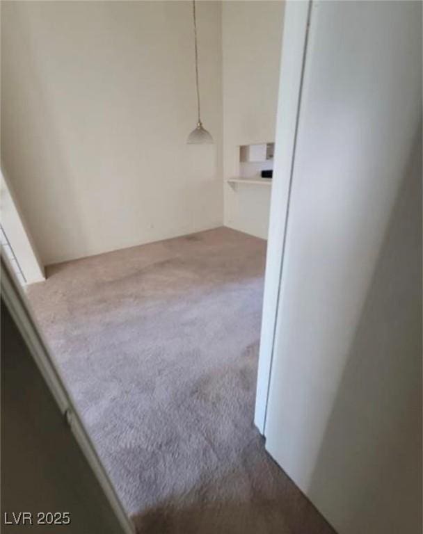 unfurnished room featuring carpet