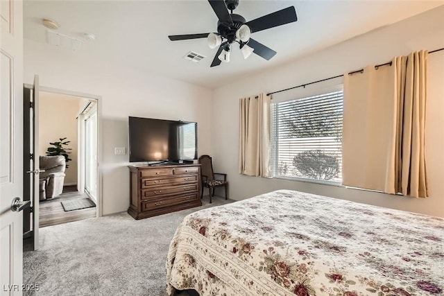 carpeted bedroom with ceiling fan