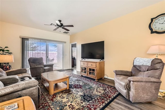 living room featuring wood-type flooring and ceiling fan