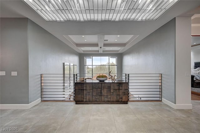 corridor featuring coffered ceiling, light tile patterned floors, and beam ceiling