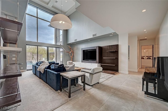 tiled living room featuring a towering ceiling