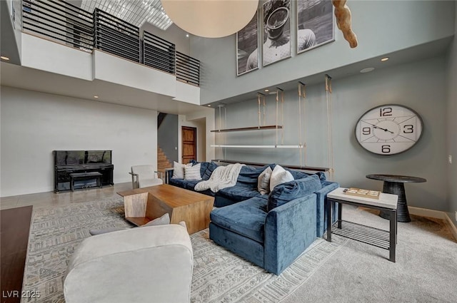 living room featuring a towering ceiling