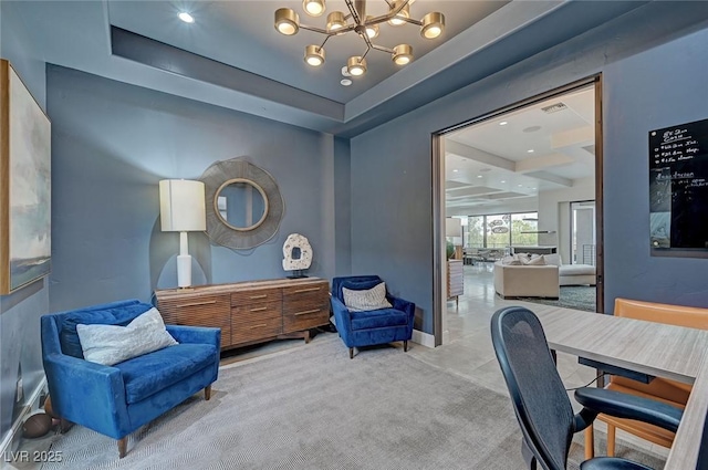 office area with light colored carpet, a notable chandelier, and a tray ceiling