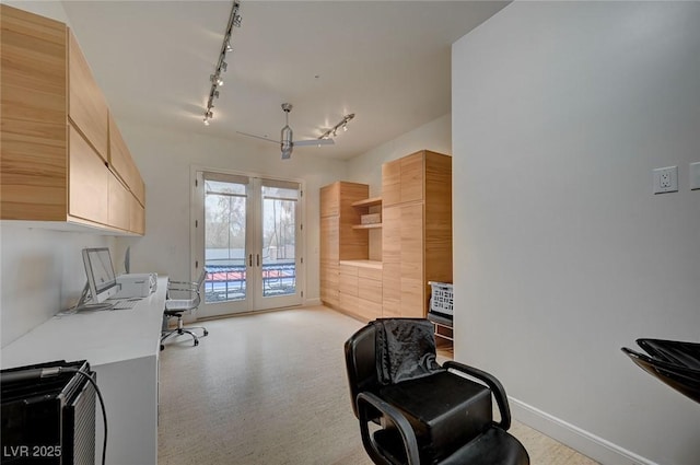 home office with french doors and rail lighting