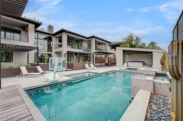 view of pool featuring an in ground hot tub and a patio area