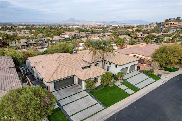 birds eye view of property featuring a mountain view