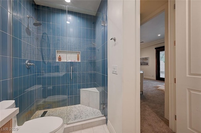 bathroom featuring vanity, crown molding, toilet, and walk in shower