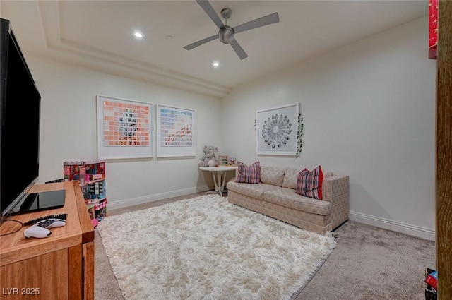 interior space featuring ceiling fan and carpet