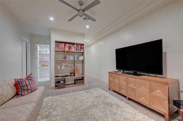 living room with ceiling fan and carpet flooring