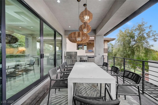 balcony featuring area for grilling and exterior kitchen