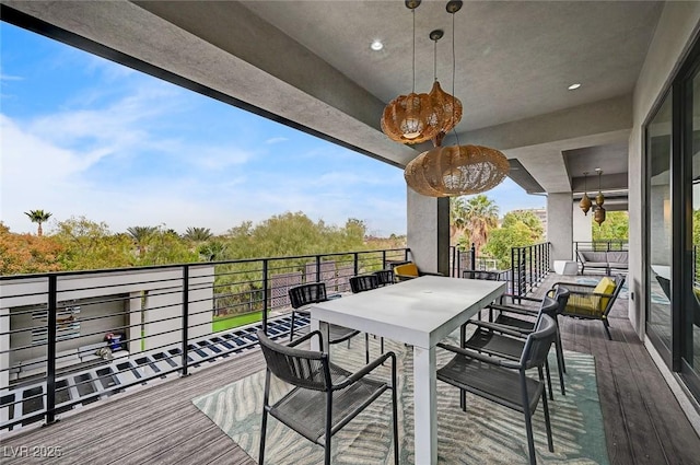 deck with an outdoor living space and ceiling fan