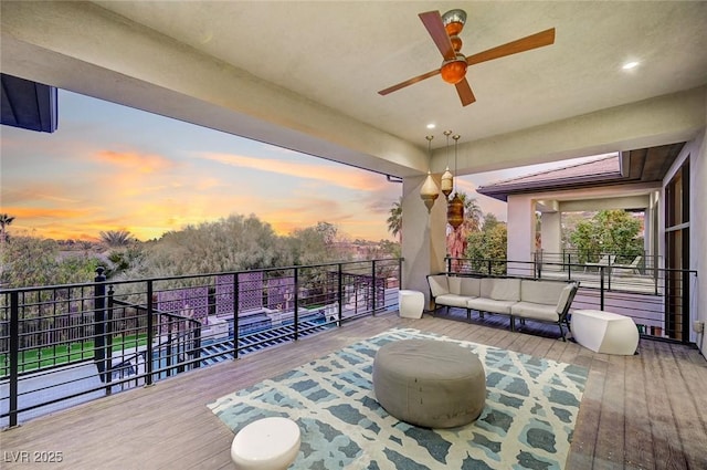 exterior space featuring outdoor lounge area and ceiling fan