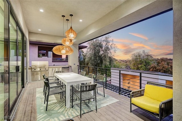 balcony at dusk featuring grilling area