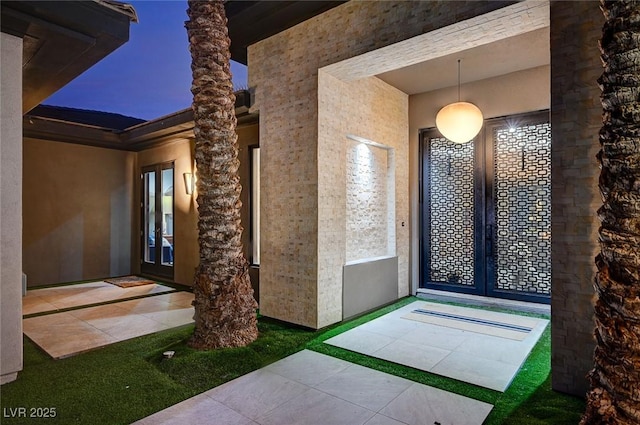 property entrance featuring french doors