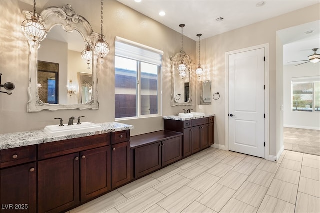 10179 Emerald Sunset Ct, Las Vegas, NV 89148 - bathroom featuring plenty of natural light, ceiling fan, a chandelier, two vanities, and recessed lighting